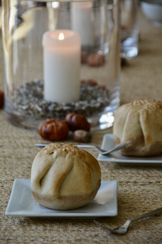Baked apples wrapped in pastry are being served embracing autumn and its comforting flavors.