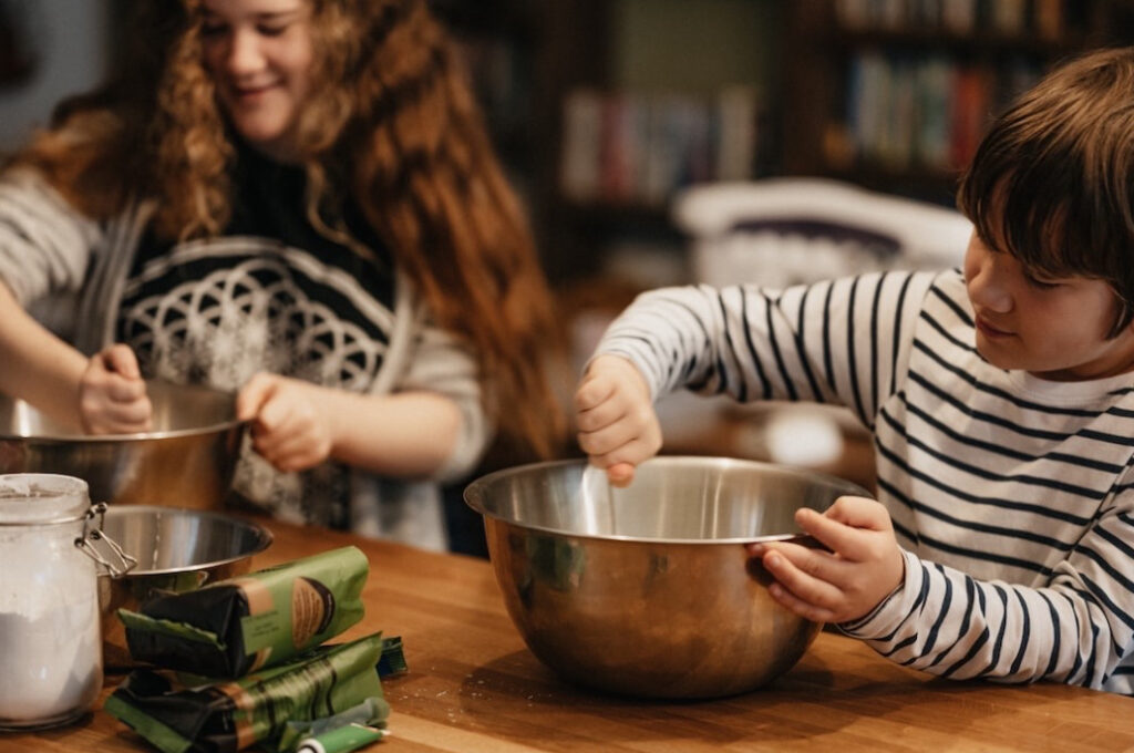 children baking in the kitchen together enjoying deep winter joy at home