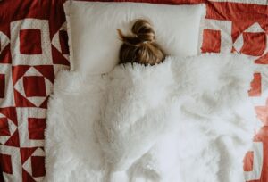 sick preschooler bundled up resting cozily in bed nurturing through sick days